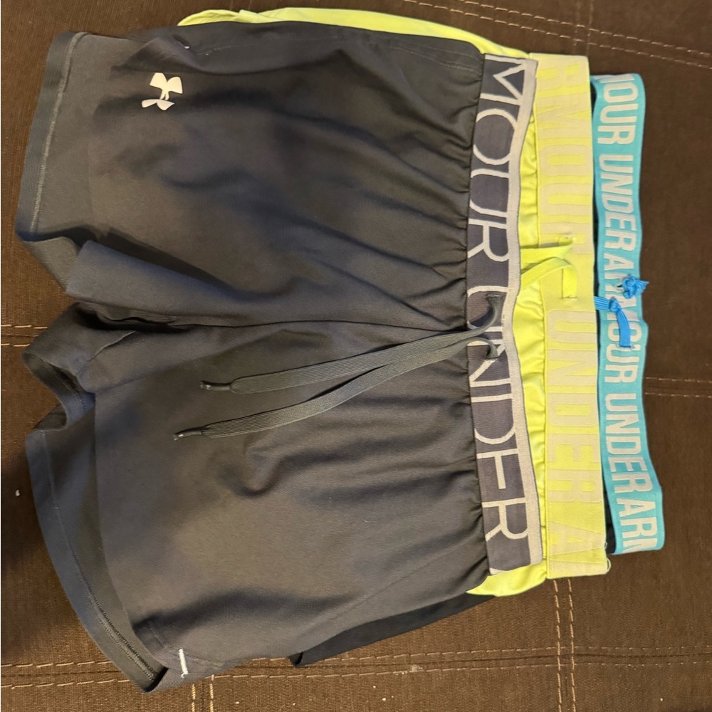 Under Armour Woman’s athletic shorts in Gray, Blue, and Yellow